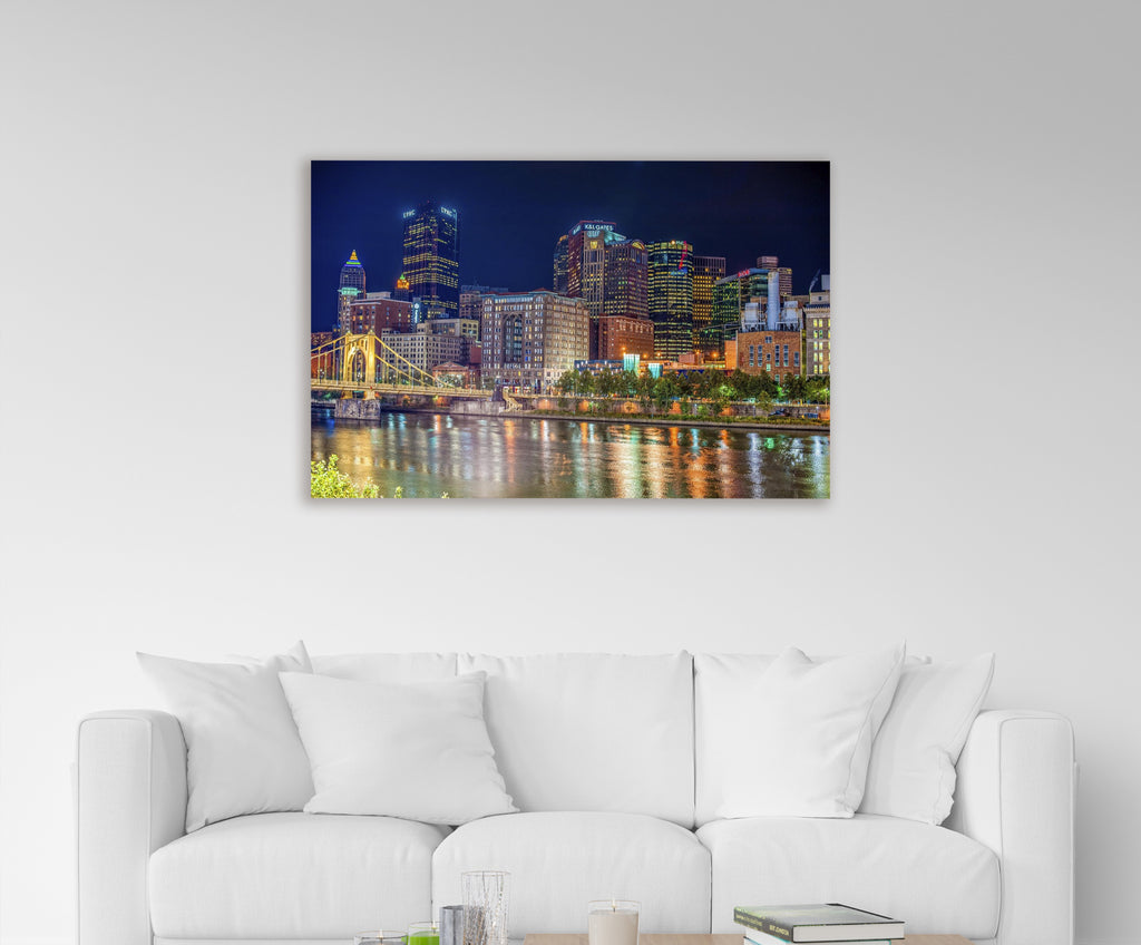 Pittsburgh Skyline Night River Reflections Glass Wall Art in a modern interior