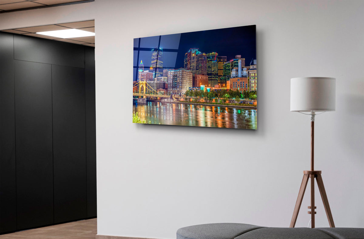 Pittsburgh Skyline Night River Reflections Glass Wall Art on the wall